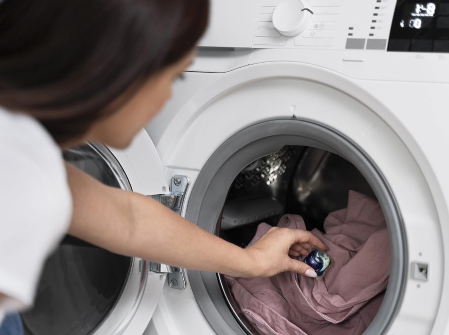 woman using capsule wash her clothes min